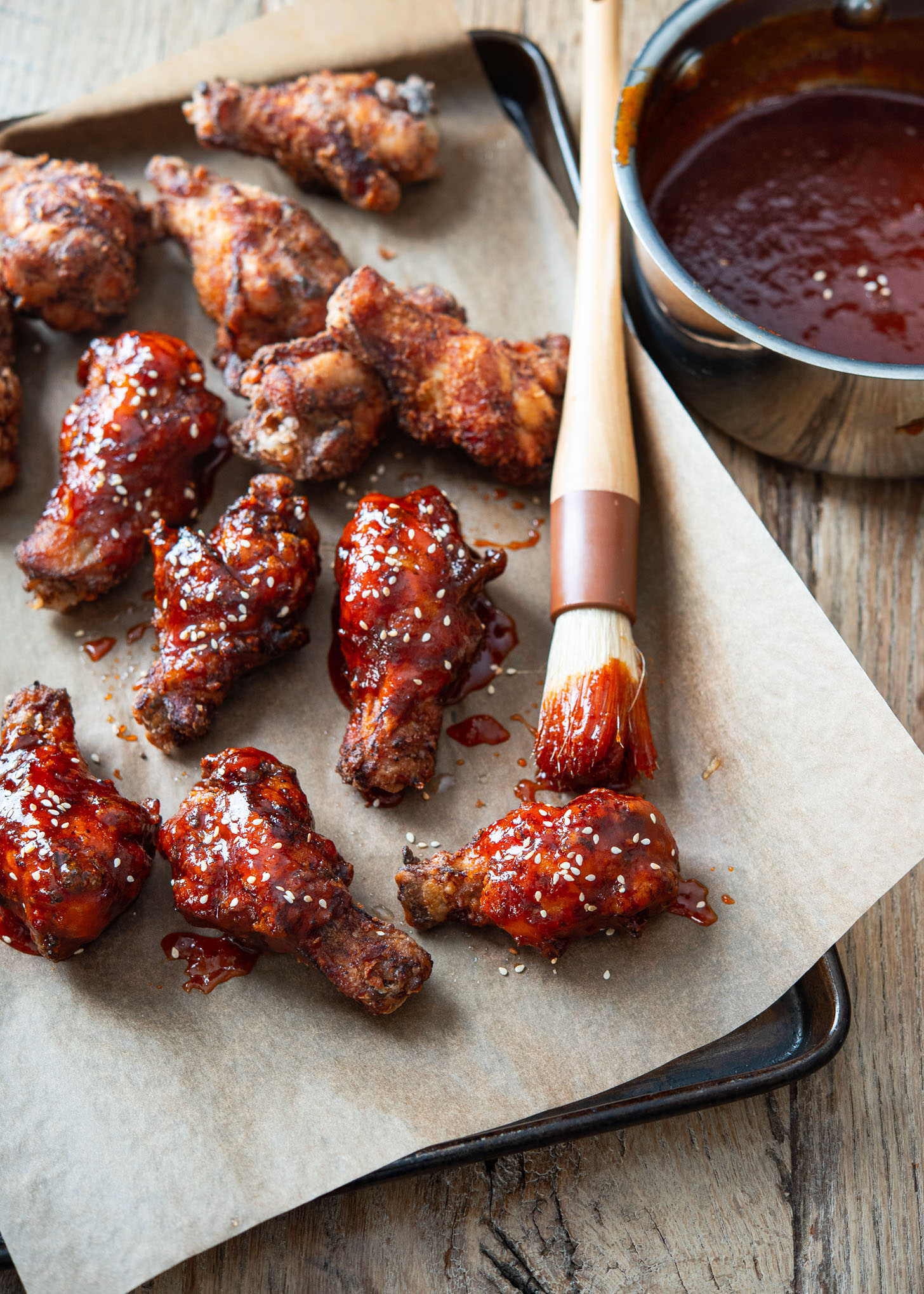 Gochujang sauce glaze brushed on crispy deep-fried wings.