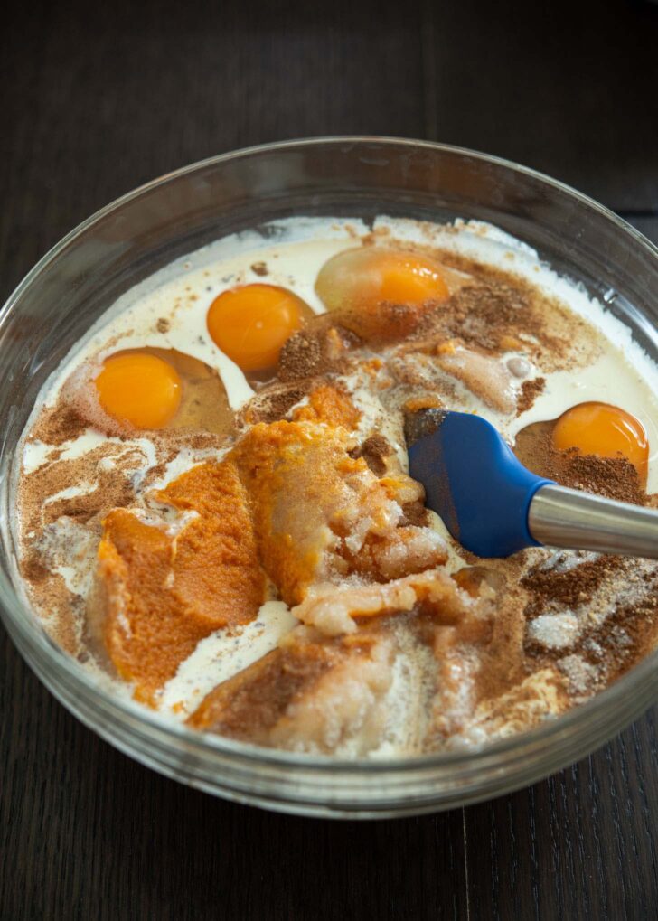 Pumpkin pie filling mixed in a large bowl.