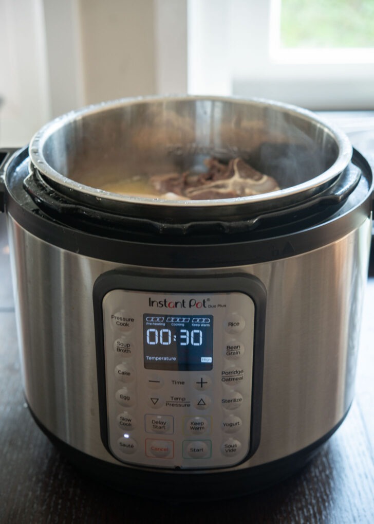 Using saute mode of instant pot to boil beef bones.