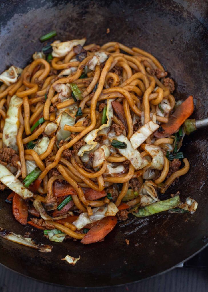 Japanese stir-fried udon noodles finished cooking in a wok.
