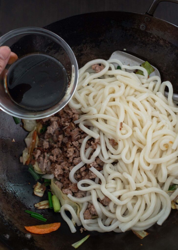 Yaki Udon sauce added to stir-fried udon noodles and vegetables.