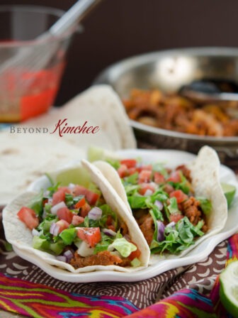 Spicy Korean pork bulgogi taco with all the fixings.