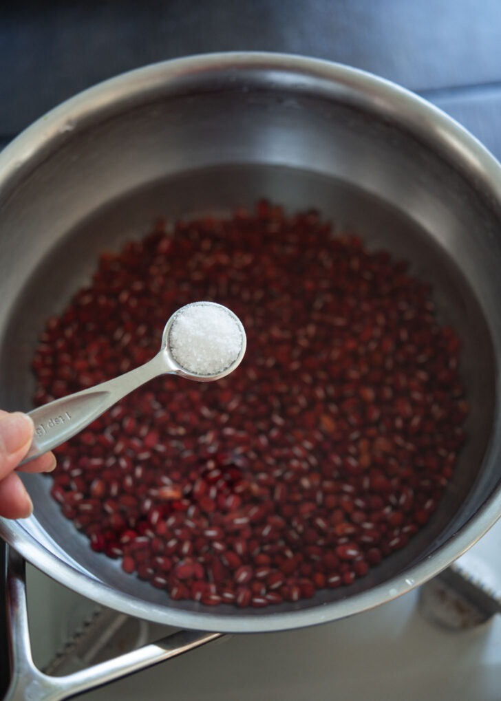 Salt added to boiling red beans.