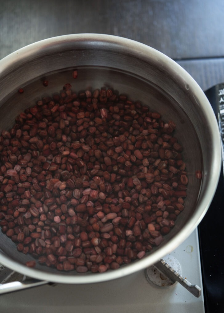 Water added to red beans in a pot.