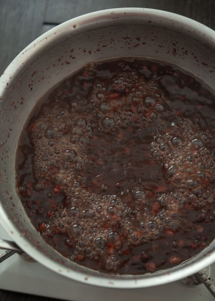 Simmering red beans in a pot.