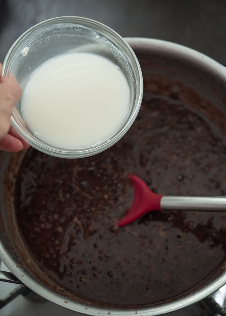 Cornstarch slurry added to sweet red bean soup to thicken.