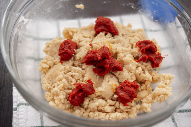 gochujang caramel paste is added by dollops to cookie dough mixture.