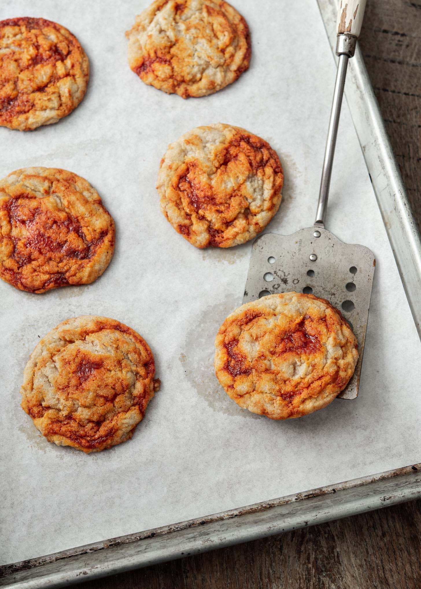 A spatula lifting a baked gochujang cookie.