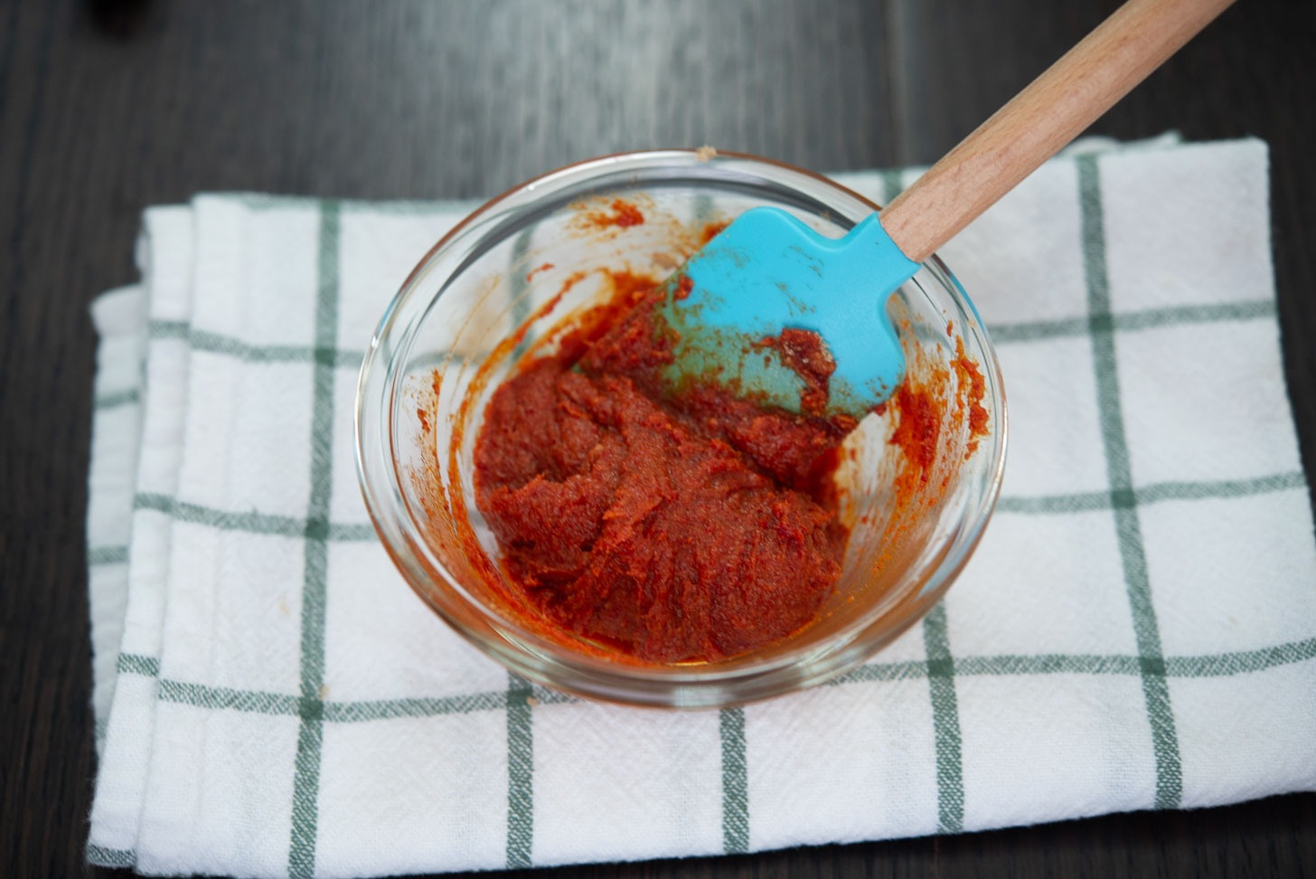 Gochujang caramel ingredients combined in a small bowl.