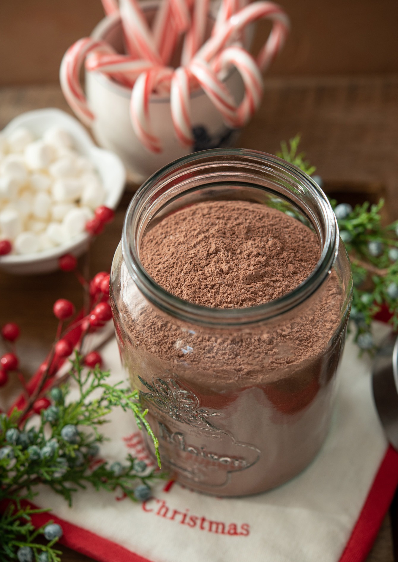 Homemade hot cocoa mix in a glass jar.