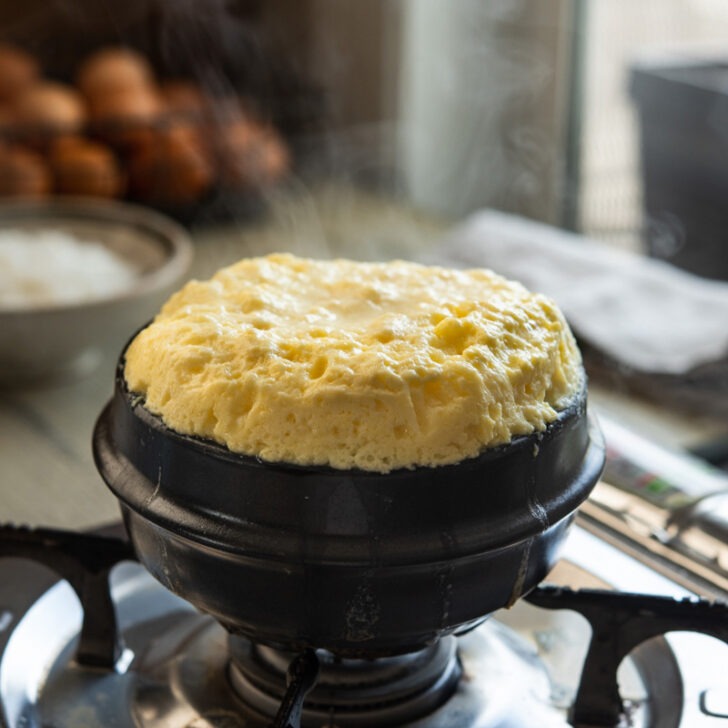 Steaming hot volcanic Korean egg cooked in a stone pot.