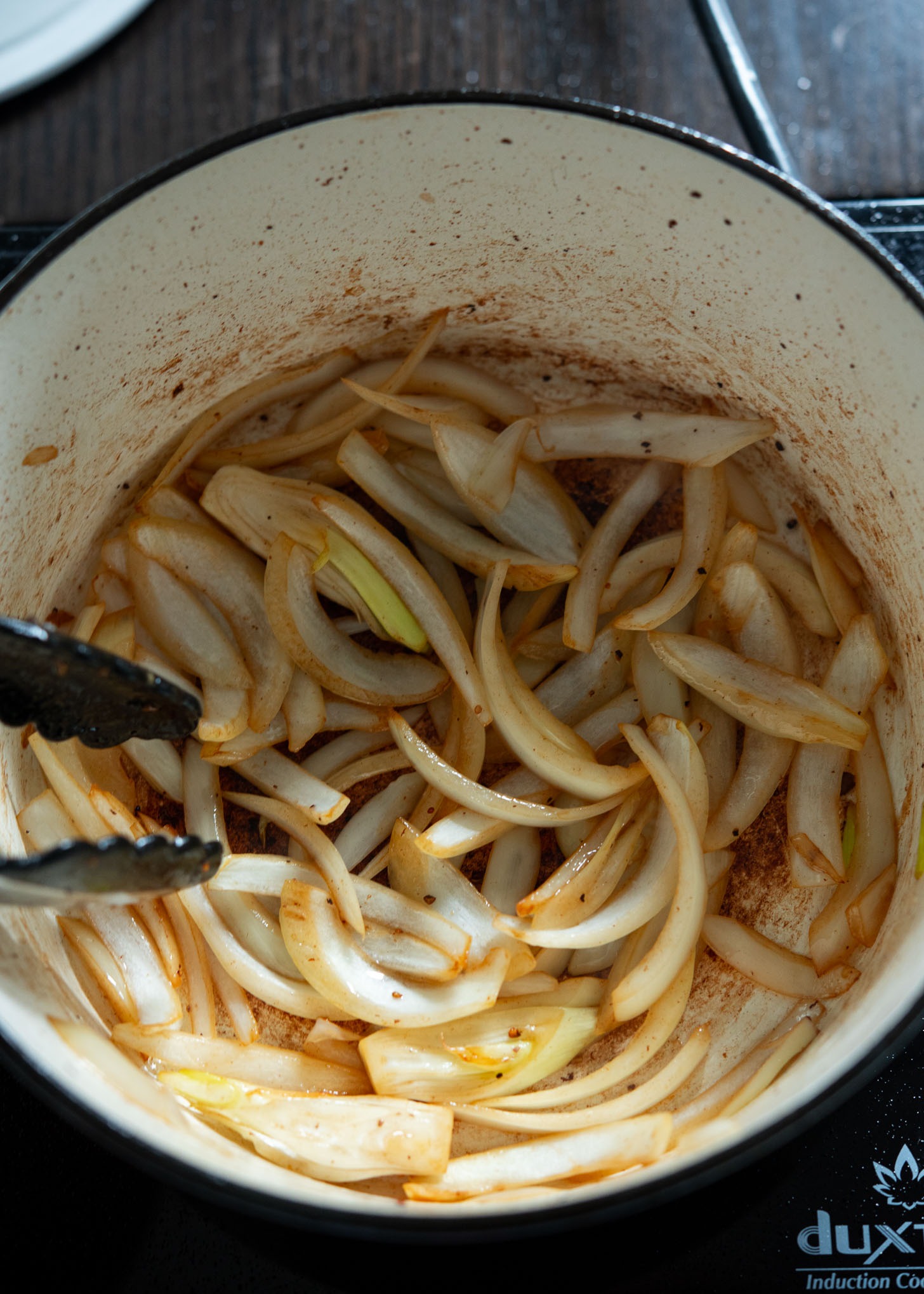 Sautéing onion until softened.