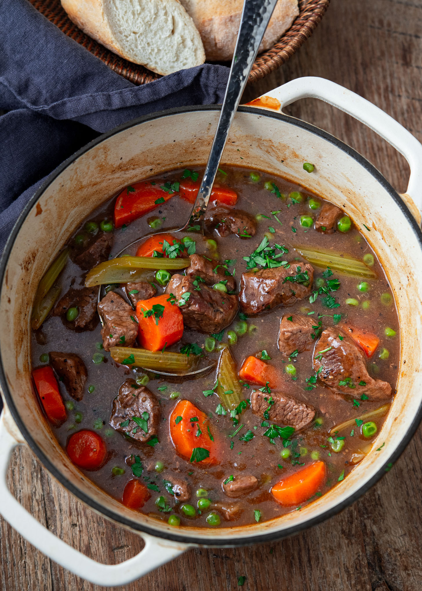 A pot of beef stew with hearty vegetables.