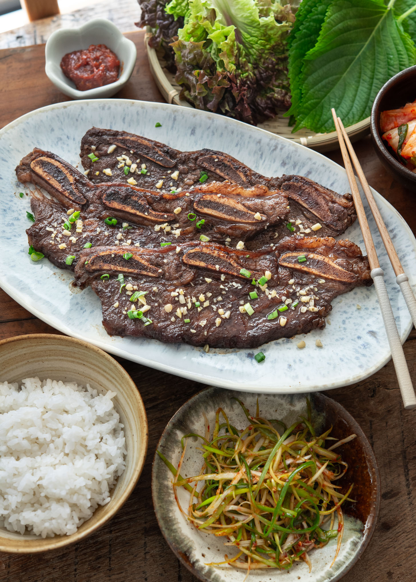 LA galbi served with rice and other side dishes.