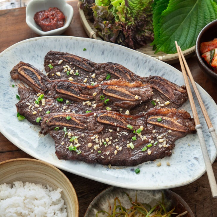 LA galbi served with rice and other side dishes.