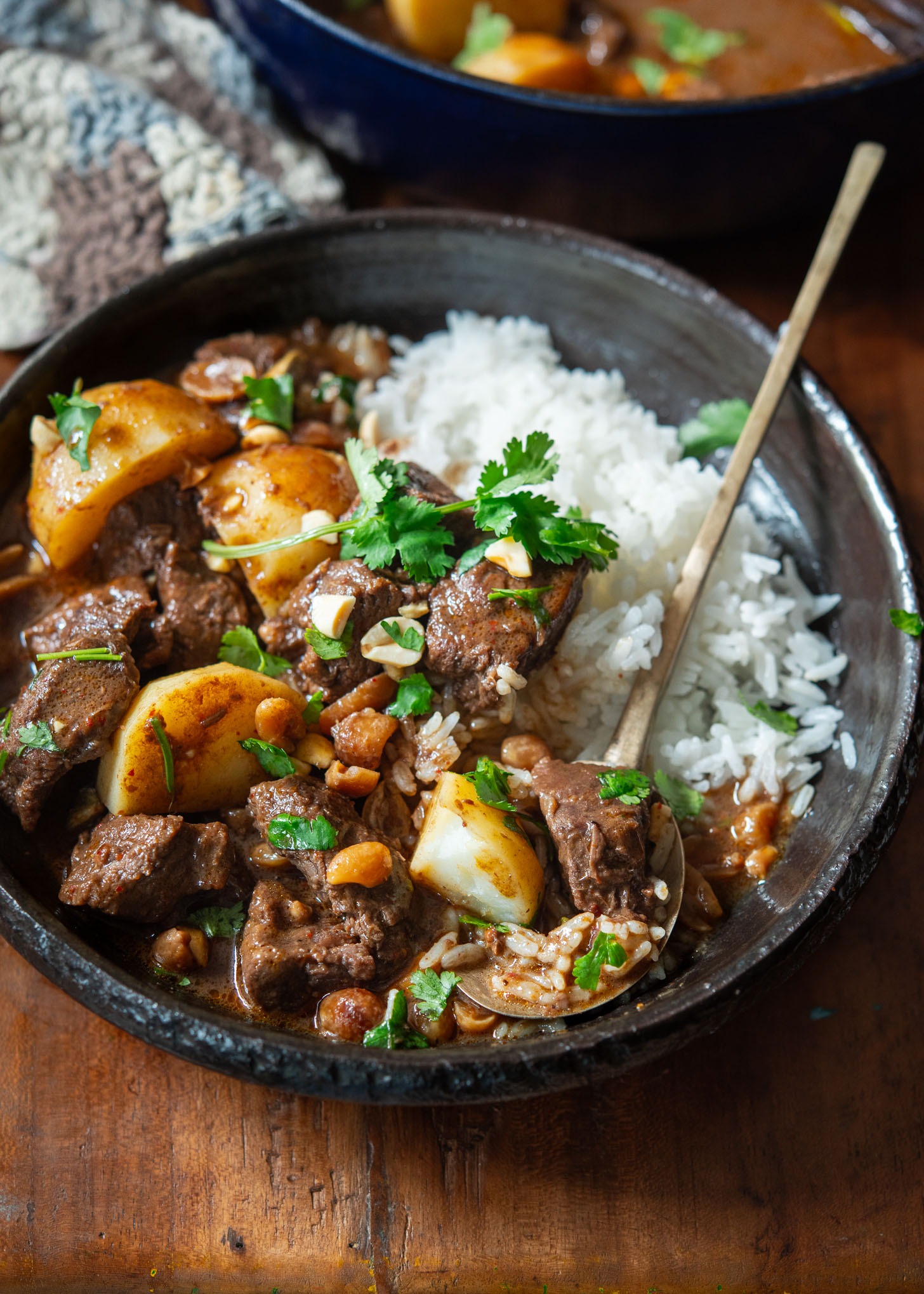 Thai beef massaman curry served with rice in a bowl.