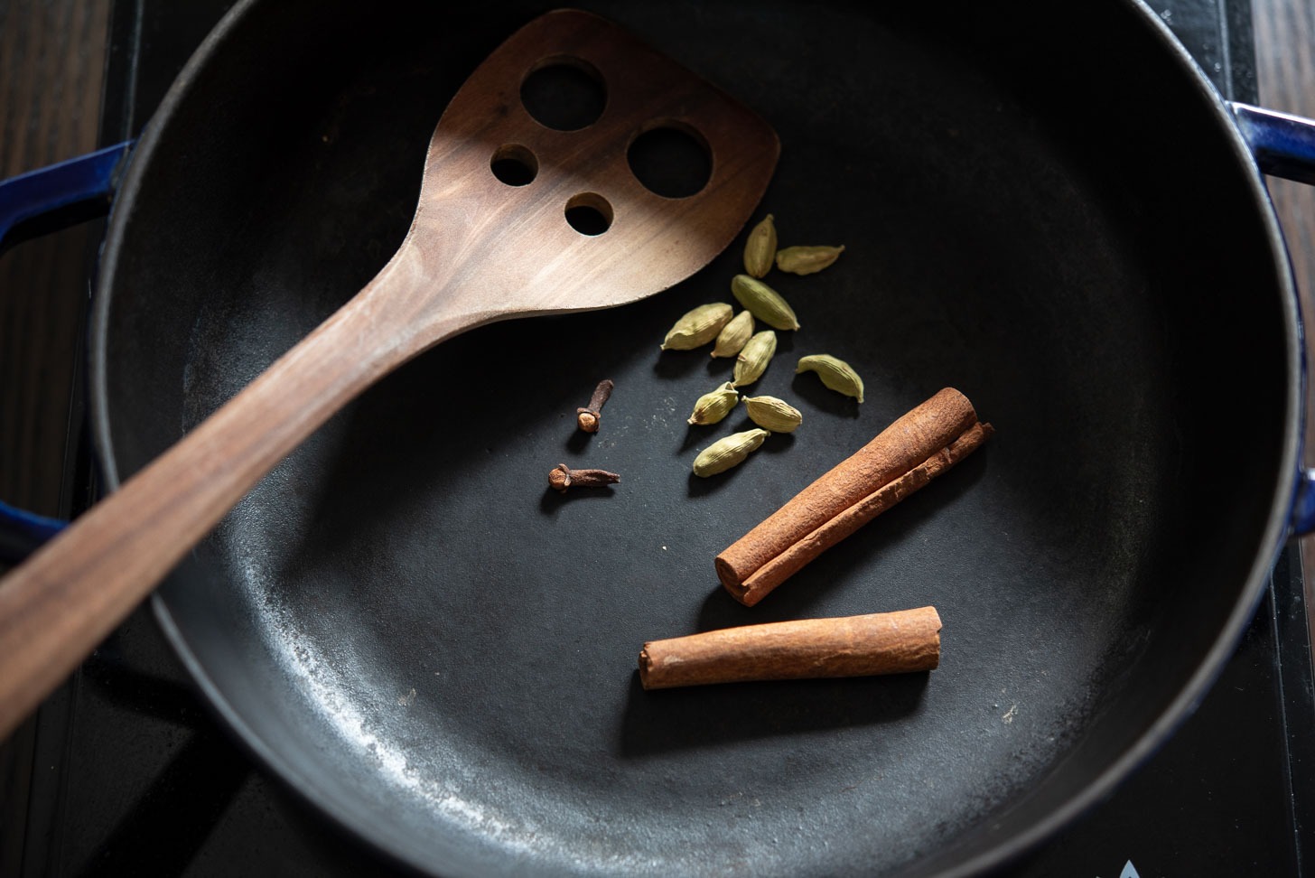 Fragrant spices toasting in a pan.