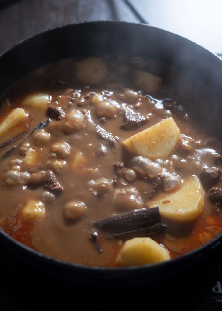 Beef massaman curry simmering in the sauce.