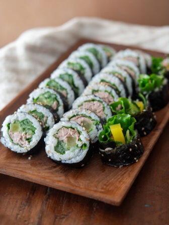 Tuna kimbap slices on a serving platter.