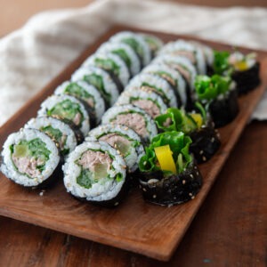 Tuna kimbap slices on a serving platter.