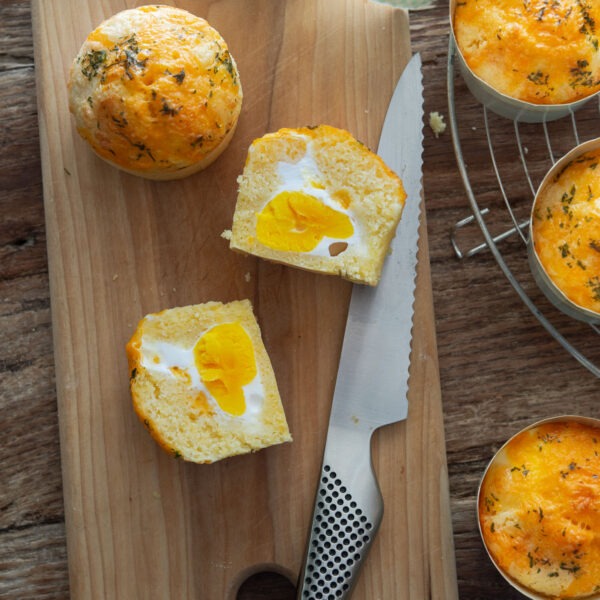 Korean egg bread sliced in half showing whole egg inside.