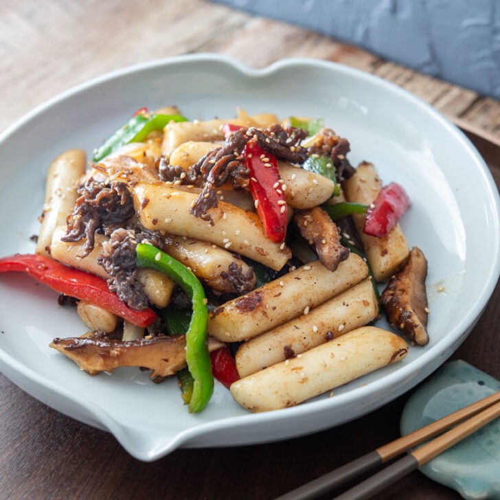 Non-spicy royal court tteokbokki with beef and vegetables.