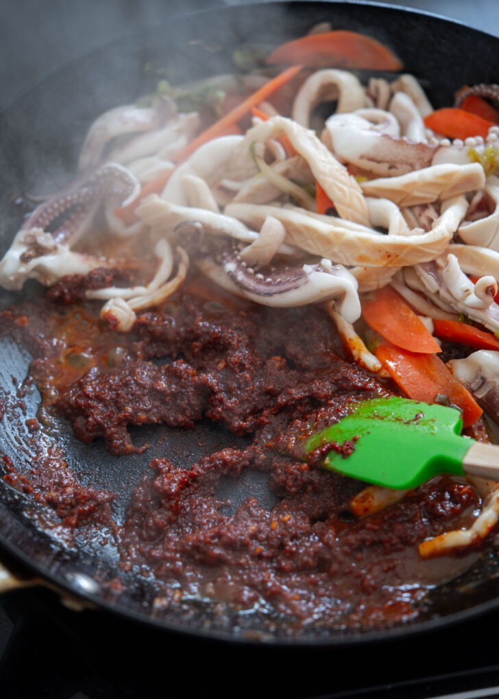 Spicy sauce stir-fried in squid vegetabel juice in a skillet.