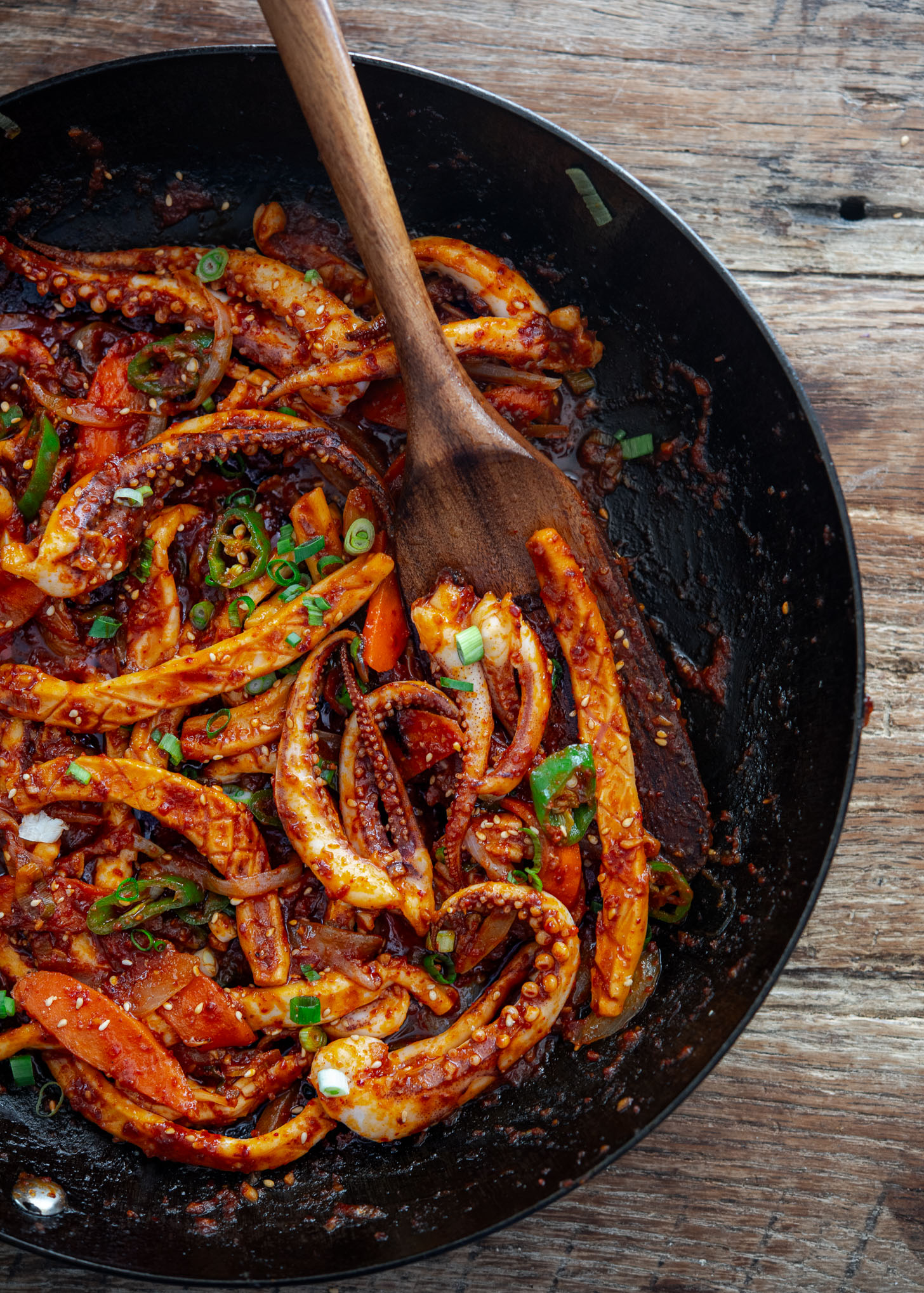 Korean spicy squid stir-fry in a wok.