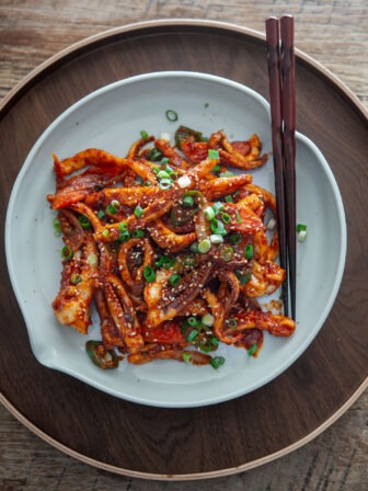 Korean spicy squid stir-fry (ojingeo bokkeum) in a serving dish.