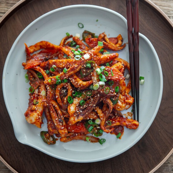 Korean spicy squid stir-fry (ojingeo bokkeum) in a serving dish.