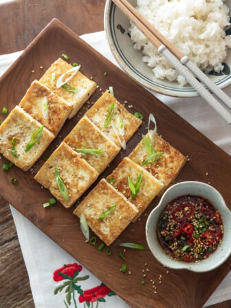 Korean style crispy pan-fried tofu with dipping sauce.