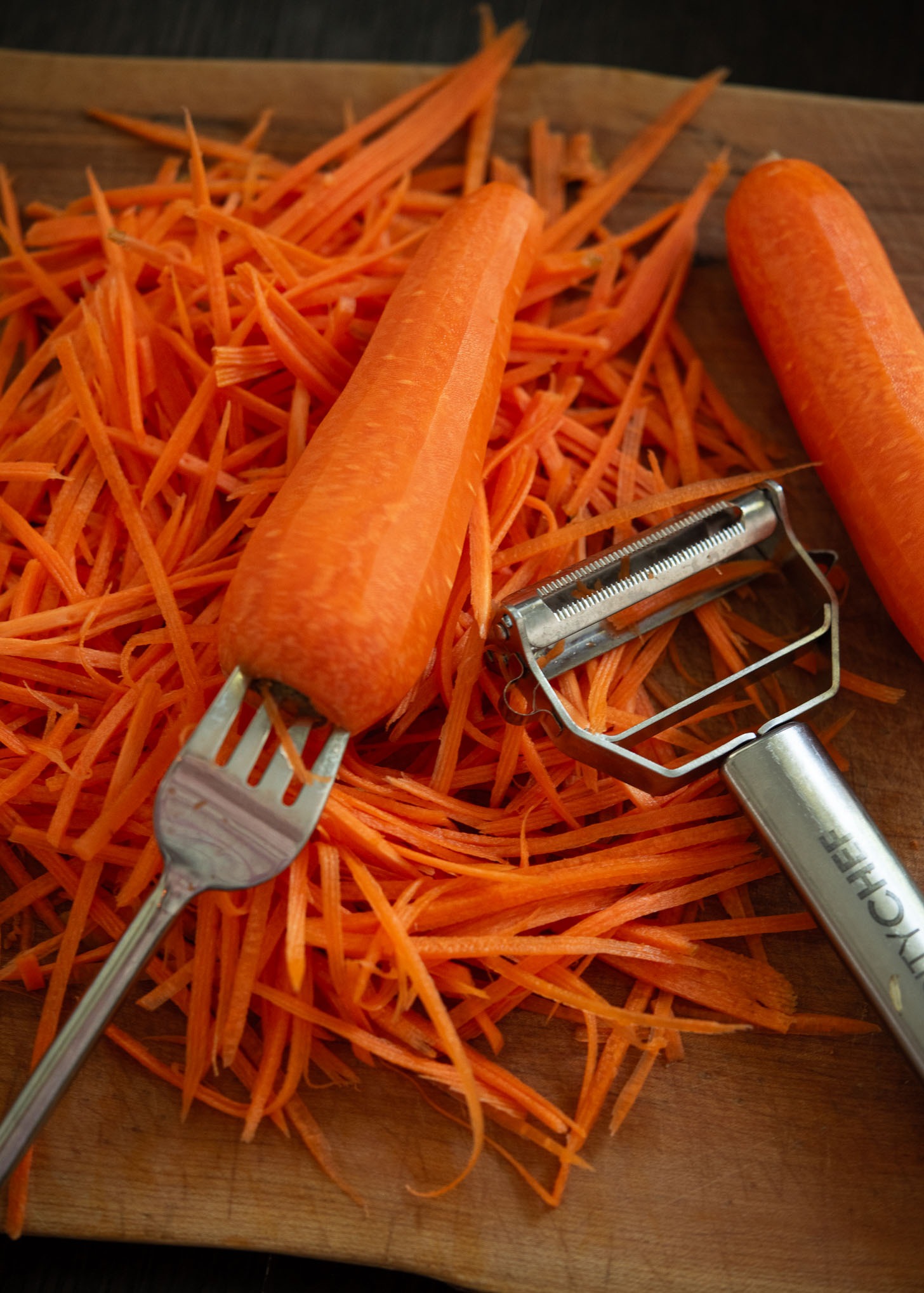 Julienned carrots with vegetable peeler.