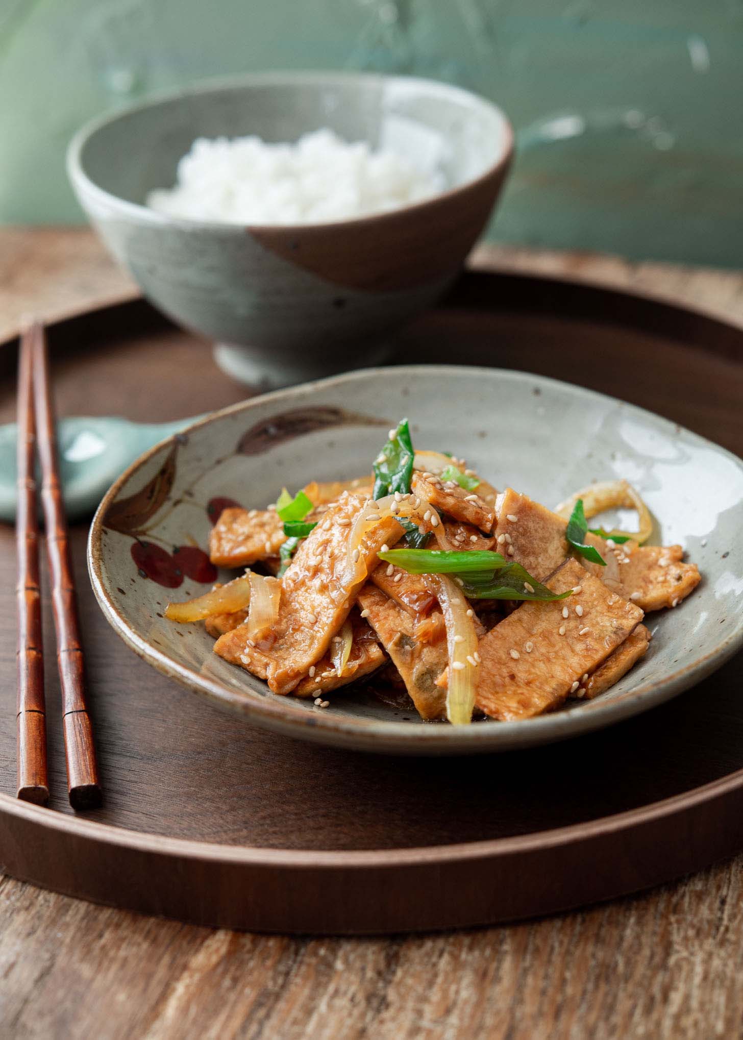 Eomuk bokkeum with a bowl of rice on a tray.