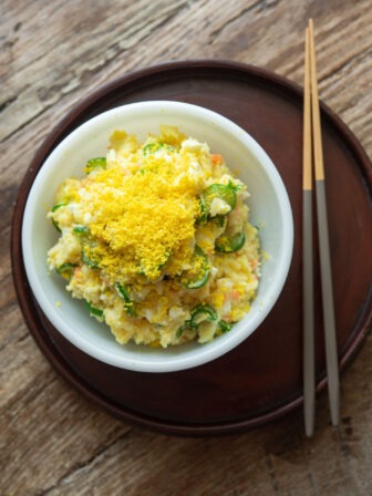Korean potato salad in a bowl with chopsticks.