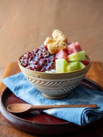 Patbingsu adorned with fresh fruits in a serving bowl.