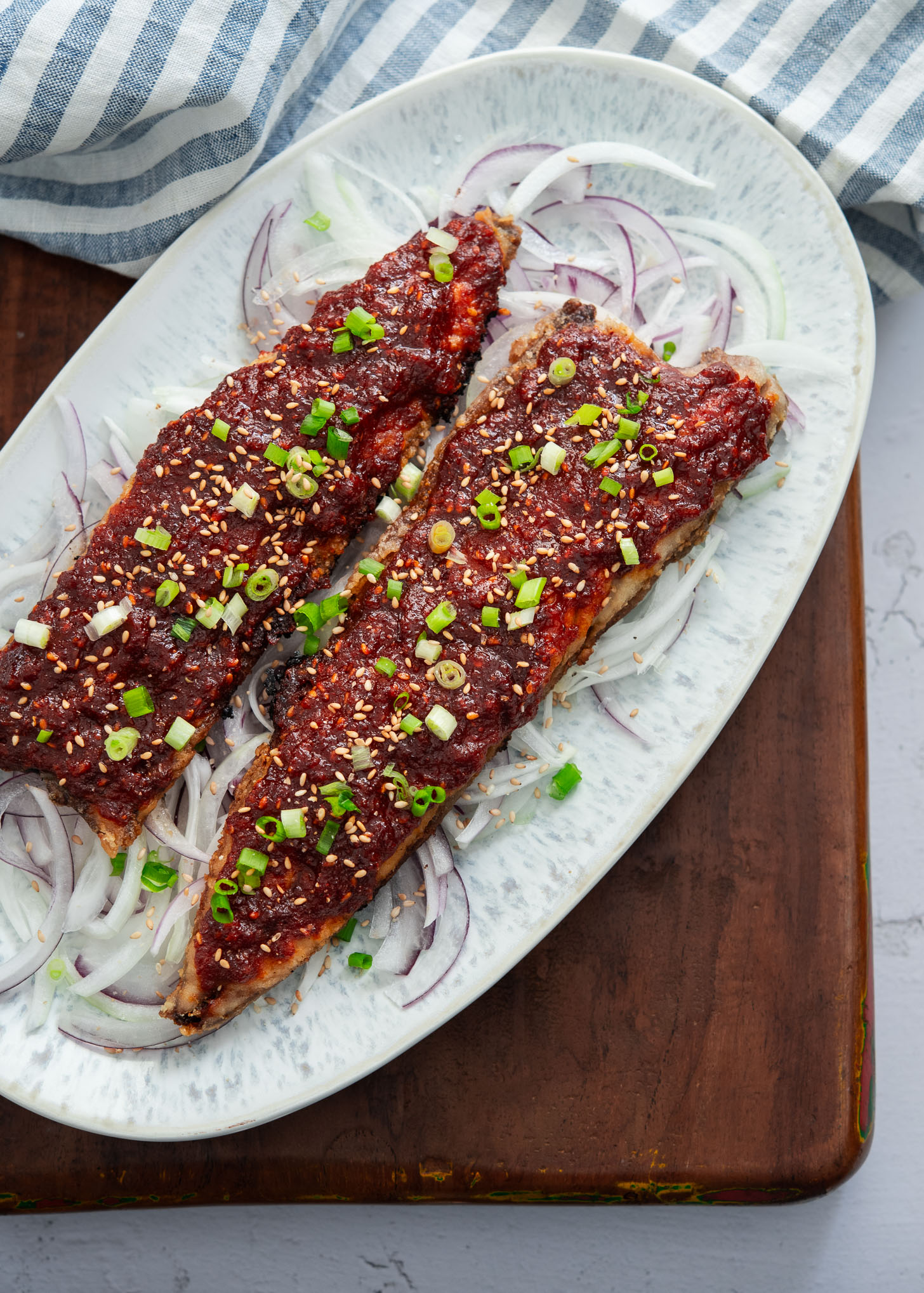 Pan fried spicy mackerel (gogalbi) served on a platter.