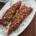 Pan fried spicy mackerel (gogalbi) served on a platter.