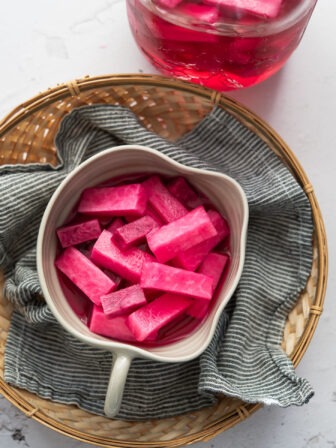 Pink pickled radish in a serving dish.