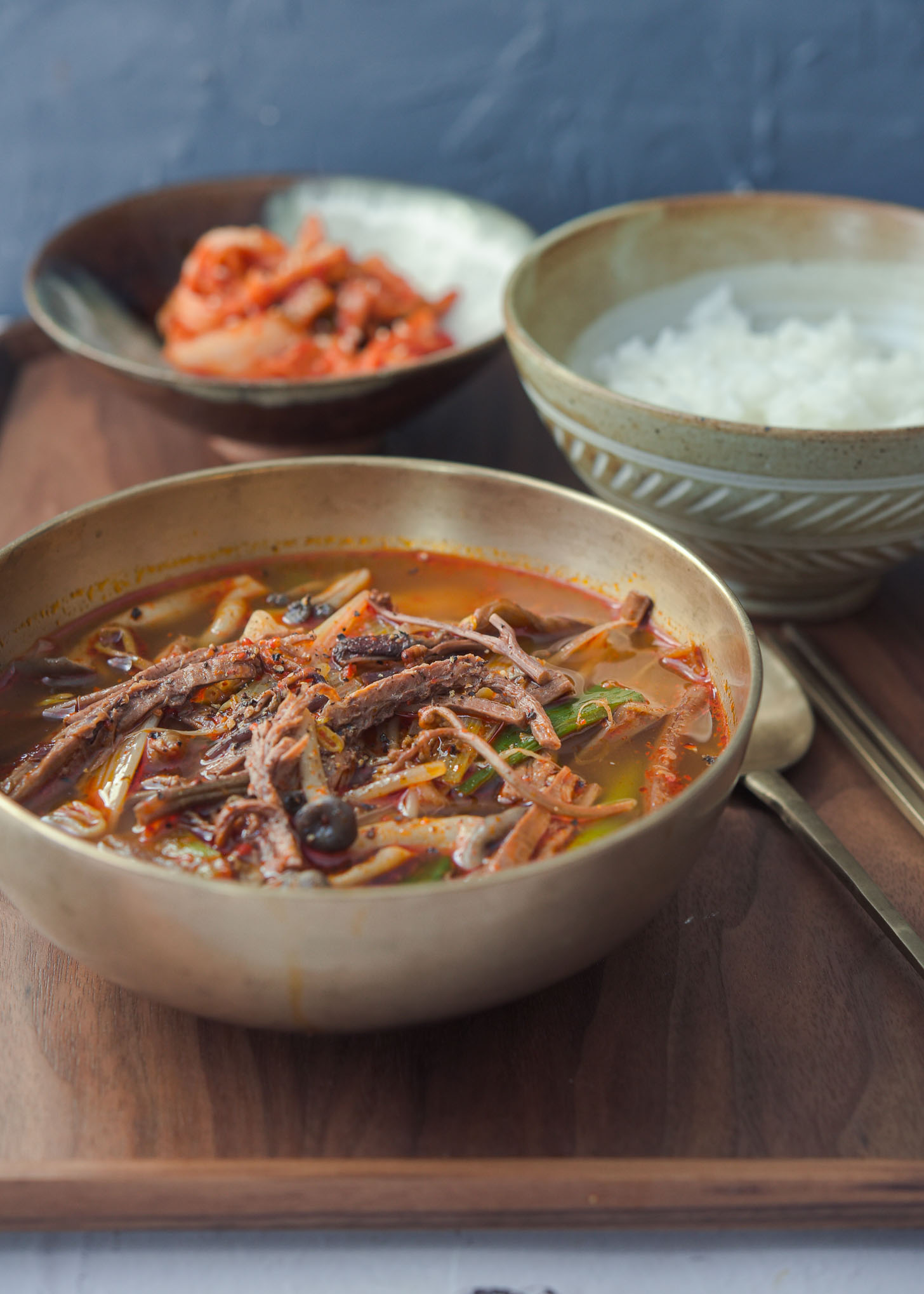 Yukgaejang Korean spicy beef soup served with rice and kimchi