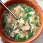 Thai chicken rice soup (Khao Tom Gai) in a bowl for breakfast.