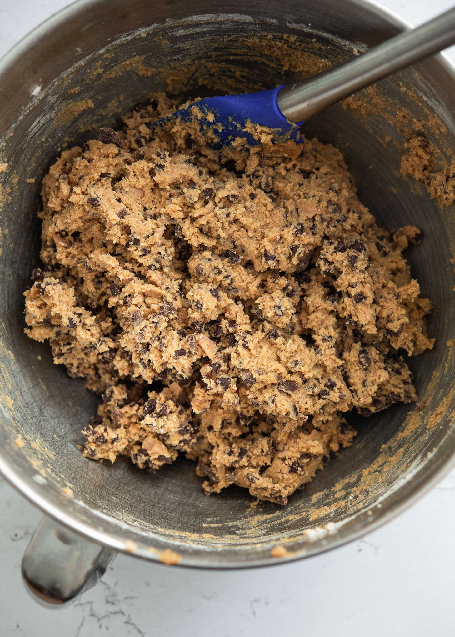 Toffee chocolate chip cookie dough in a mixing bowl.