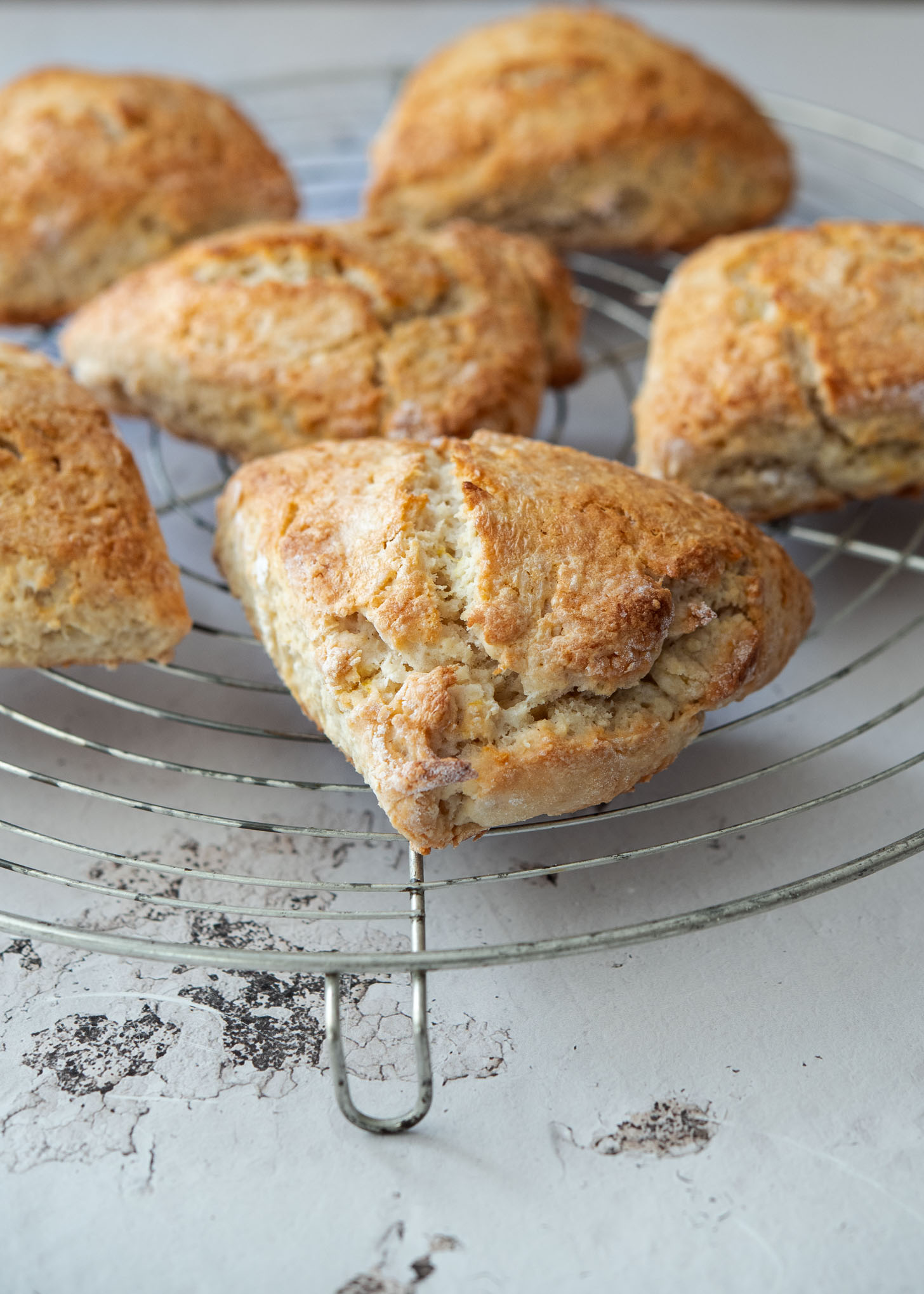 Lemonade scones cooling on a wired rack.