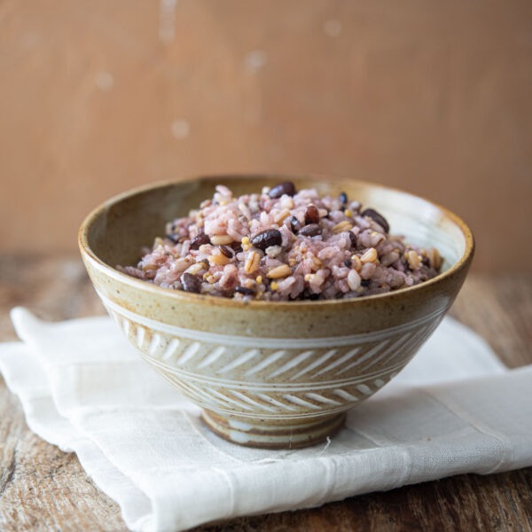 Bowl of Korean multigrain rice (japgokbap) made with 7 grains including white rice, millet, barley, black rice, and oats.
