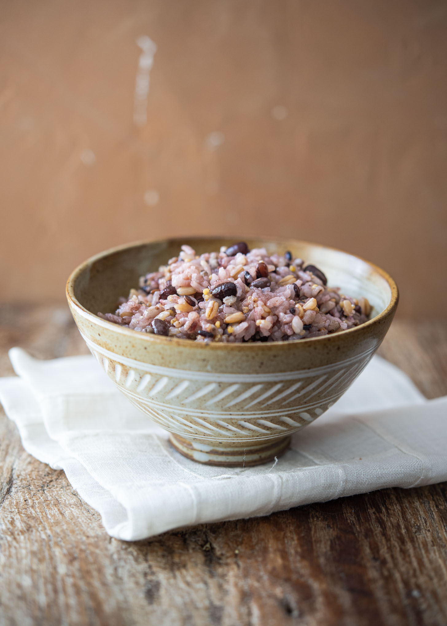 Bowl of Korean multigrain rice (japgokbap) made with 7 grains including white rice, millet, barley, black rice, and oats.