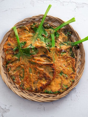 Kale gochujang pancakes in a basket tray.