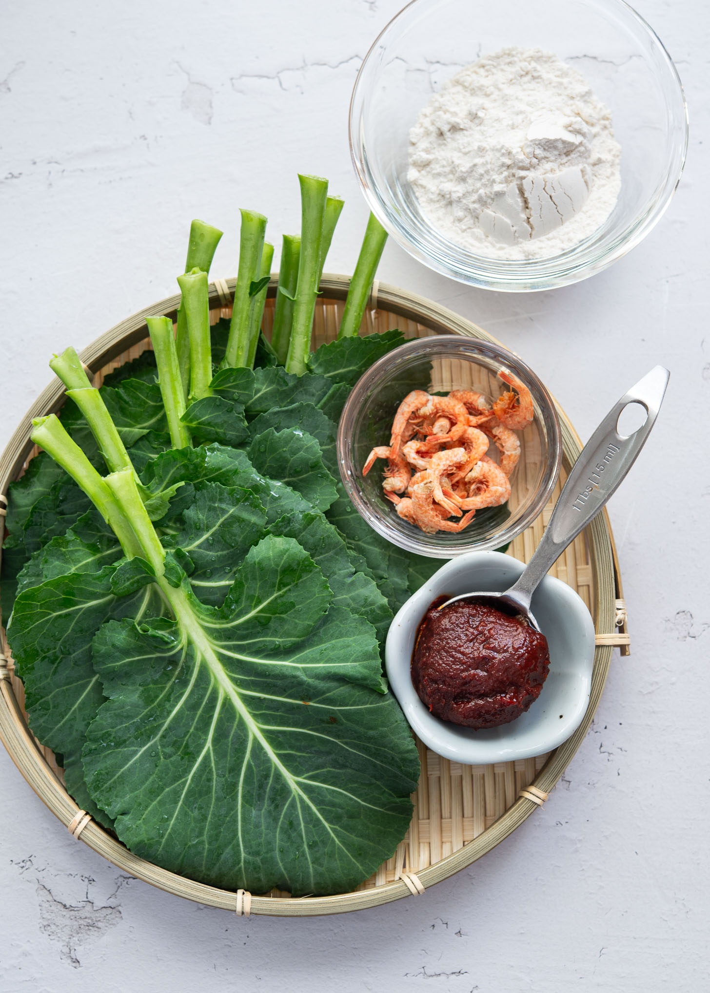Ingredients laid out for making kale gochujang pancakes (jangtteok)