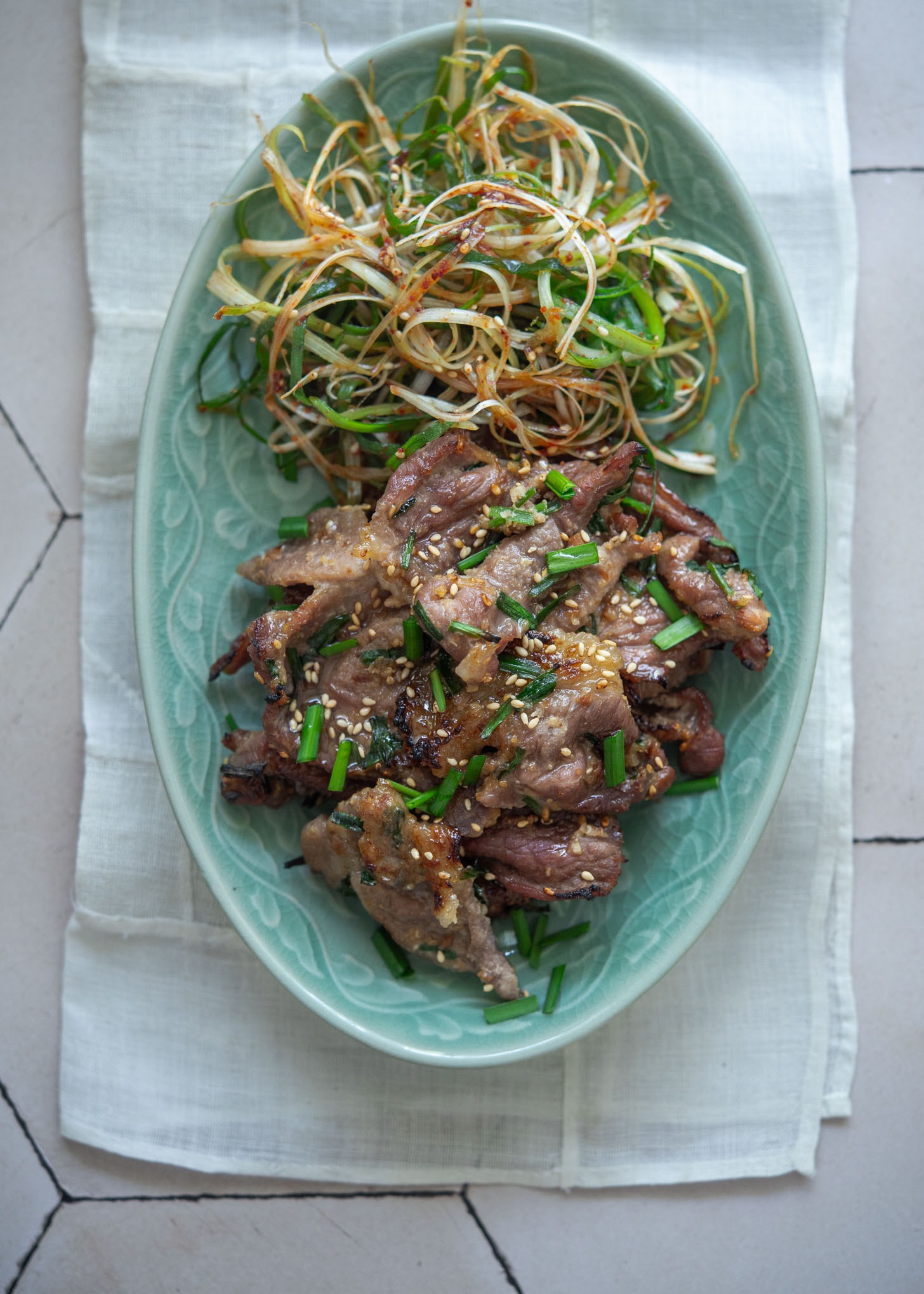Plate of maekjeok and Korean green onion salad (pa-muchim)
