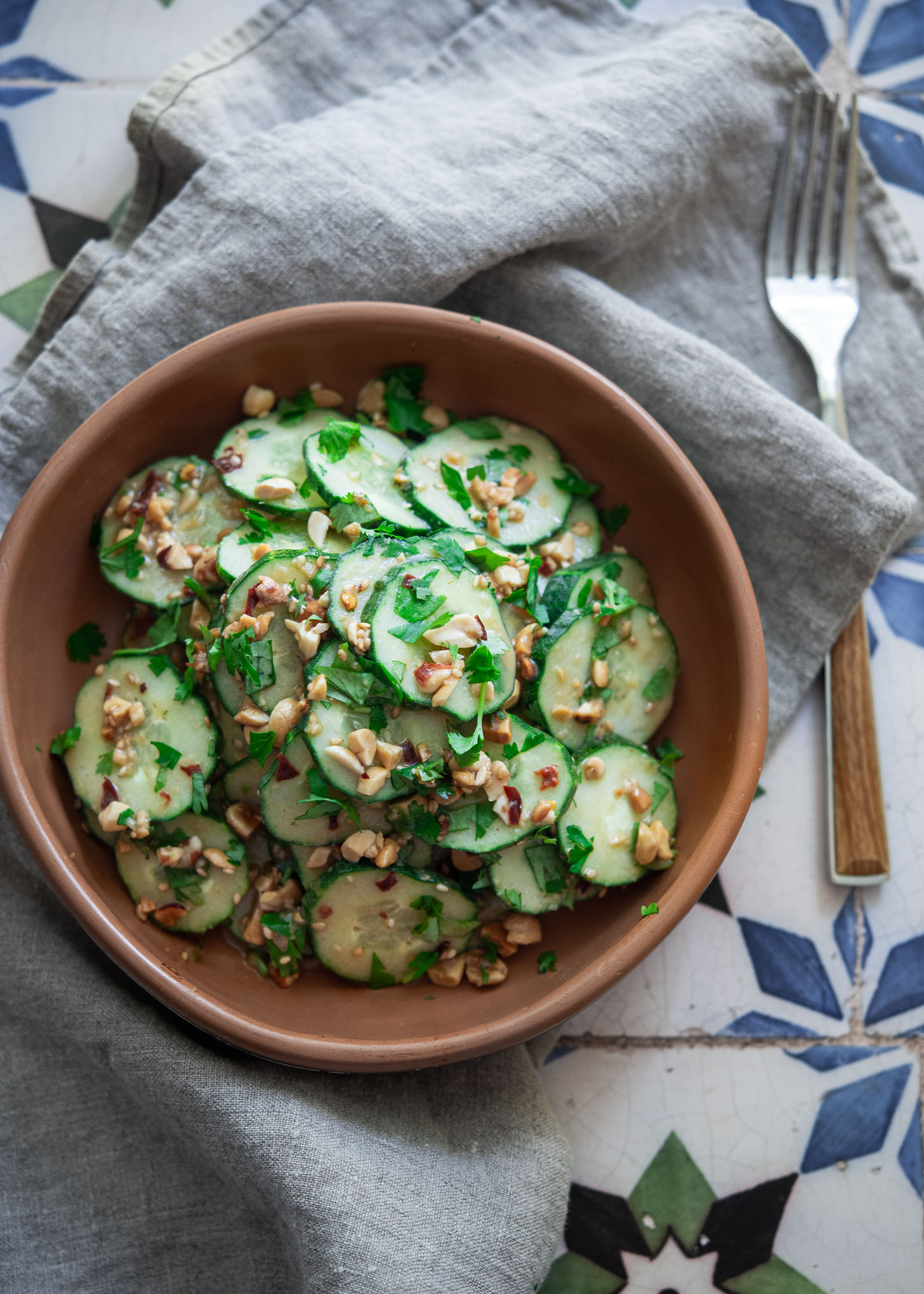 Thai-inspired spicy cucumber salad with peanuts, cilantro and chili flakes
