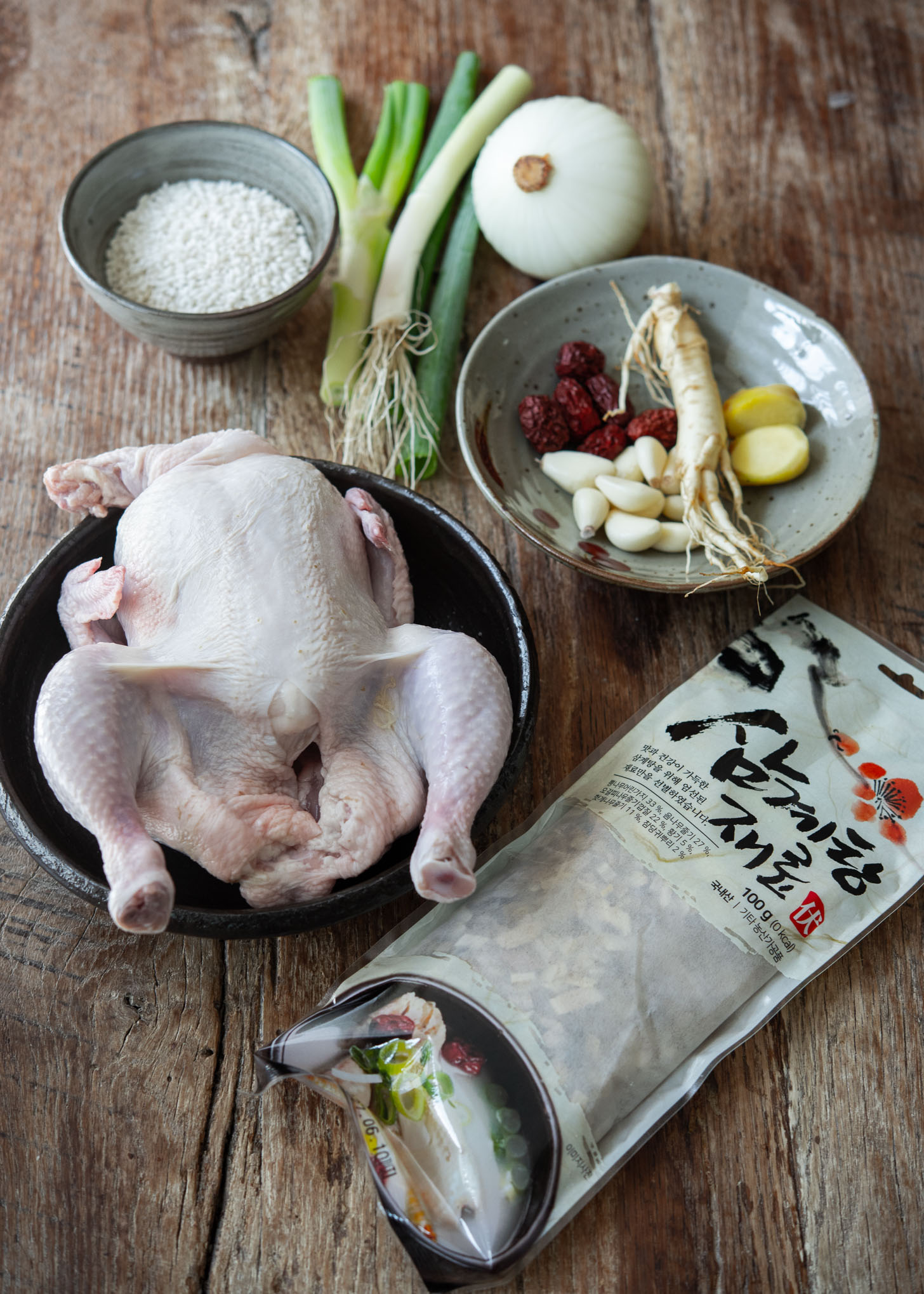 Ingredients laid out for making samgyetang (Korean ginseng chicken soup)
