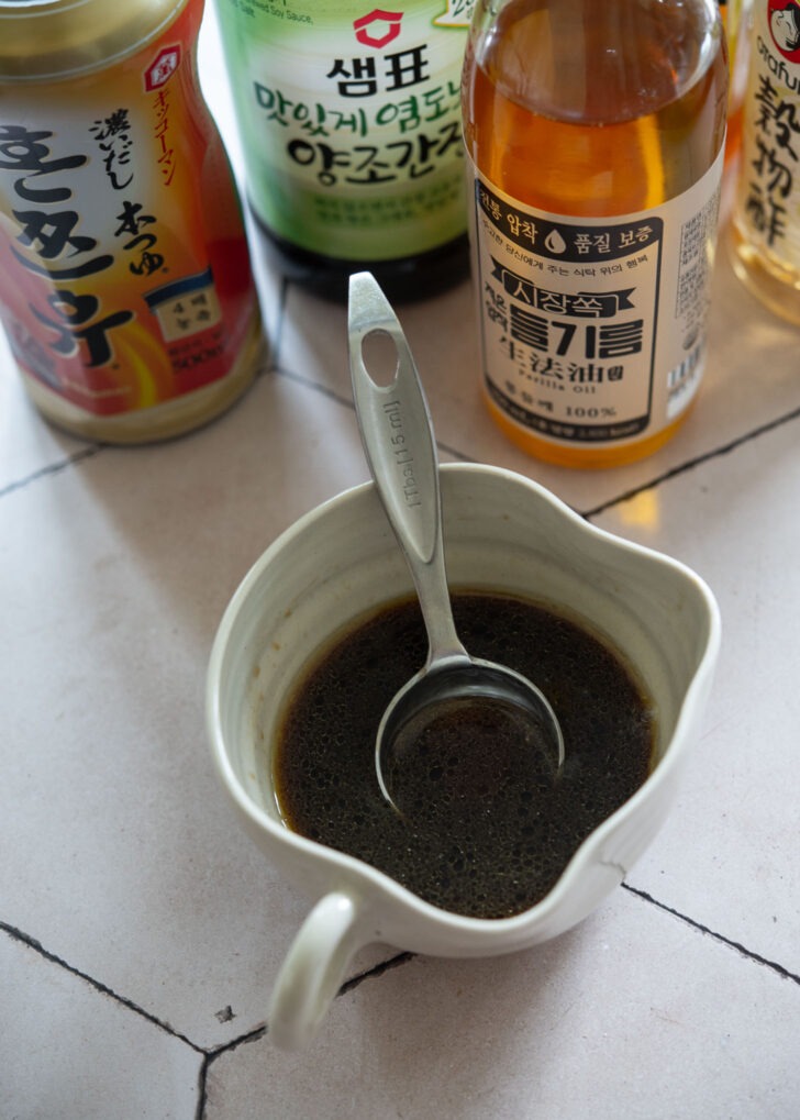 Mixing noodle dressing in a bowl